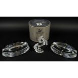 BACCARAT TRANQUILITY ASHTRAYS, a pair, along with a rearing Swarovski silver crystal stallion,