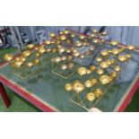 TEA LIGHT CENTER PIECES, a set of three, gilt metal, 54.5cm x 13.5cm x 12cm approx. (3)