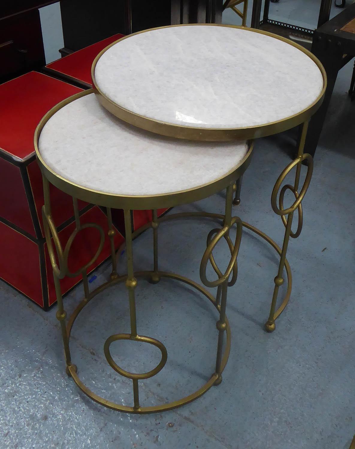 NESTING SIDE TABLES, a pair, gilt metal with marble inserts, 62cm H x 46cm diam at largest. (2)