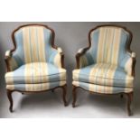 BERGERES, a pair, French Louis XV style upholstered in striped blue and yellow moire taffetta,