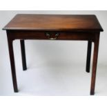 WRITING TABLE, George III period Cuban mahogany with moulded top and full width frieze drawer,