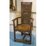 ARMCHAIR, 17th century style oak of ecclesiastical influence with carved panel back, 122cm H x