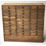 BANK OF DRAWERS, 19th century Irish oak, a bank of thirty drawers, 87cm W x 84cm H x 26cm D.