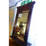 WALL MIRROR, late 19th century Continental stained wood with a rectangular bevelled plate, 92cm W