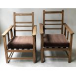 LIBERTY STYLE ARMCHAIRS, early 20th century English oak with reclining three portion backs and heart