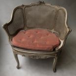 BERGERE, early 20th century French Louis XV style parcel gilt, grey painted and cane upholstered,