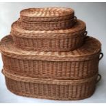 BASKETS, a graduated set of four, woven wicker oval baskets with hinged lids and handles, largest