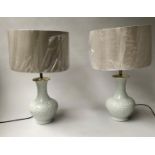 LAMPS, a pair, Chinese ceramic blanc de chine vase form with shades approx 65cm H. (2)