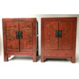 CHINESE SIDE CABINETS, a pair, early 20th century red lacquer each with a pair of panelled gilt