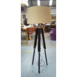 FLOOR LAMP, with a shade on a folding ebonised tripod base, 134cm H.