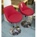 BAR STOOLS, a set of three, contemporary, height adjustable, red fabric upholstered, 107cm at