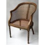 ARMCHAIR, Victorian beech framed and cane panelled with bobbin turned supports.