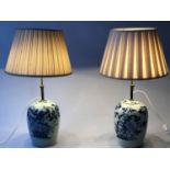 LAMPS, a pair, blue and white ceramic and Chinoiserie decorated (adjustable shades) lowest 51cm