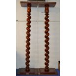 PAIR OF MAHOGANY STAINED TWIST COLUMNED TORCHIERES