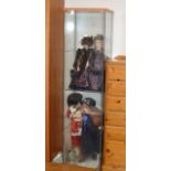 GLASS DISPLAY CABINET WITH VARIOUS DOLLS THERE IN