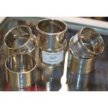 7 VARIOUS STERLING SILVER NAPKIN RINGS - APPROXIMATE COMBINED WEIGHT = 158.7 GRAMS