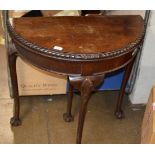 MAHOGANY FOLD OVER GAMES TABLE ON BALL & CLAW FEET
