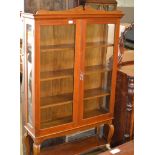 STAINED OAK DOUBLE DOOR BOOKCASE WITH UNDER SHELF