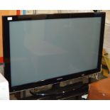 LARGE SAMSUNG PLASMA TV WITH GLASS STAND