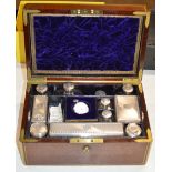 A WILLIAM IV BRASS BOUND MAHOGANY VANITY BOX WITH VARIOUS SILVER TOPPED JARS, BONE HANDLED BRUSHES