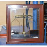 SET OF SCALES IN GLASS DISPLAY CASE & CASED SET OF WEIGHTS