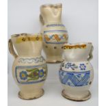 Tre brocche in maiolica smaltata - Three enameled majolica jugs