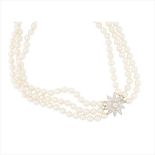 A pearl and diamond set necklace