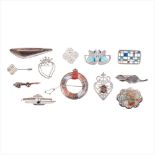 A collection of various brooches