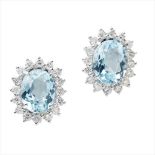 A pair of aquamarine and diamond set cluster earrings