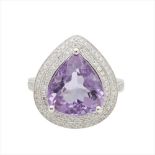 An amethyst and diamond set cocktail ring