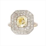 An early 20th century yellow and colourless diamond set cluster ring