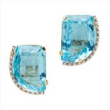 A pair of blue topaz and diamond set earrings