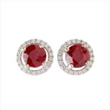 A pair of ruby and diamond set cluster earrings
