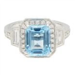 A blue topaz and diamond set ring