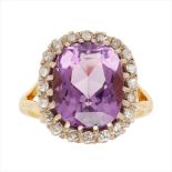 An amethyst and diamond set cluster ring