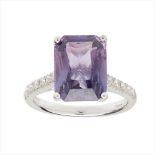 A purple sapphire and diamond set ring