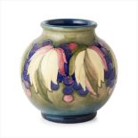 WILLIAM MOORCROFT (1872-1945) FOR MOORCROFT POTTERY 'LEAF AND BERRY' VASE, MID 20TH CENTURY
