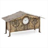 ENGLISH SCHOOL ARTS & CRAFTS PATINATED METAL MANTEL CLOCK, CIRCA 1910