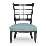 AFTER E. W. GODWIN AESTHETIC MOVEMENT EBONISED LOW CHAIR, CIRCA 1880