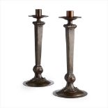 ENGLISH SCHOOL PAIR OF ARTS  & CRAFTS PATINATED COPPER CANDLESTICKS, CIRCA 1900