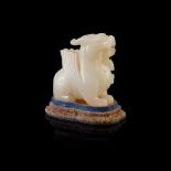 WHITE JADE CARVING OF A GRIFFIN QING DYNASTY, 18TH CENTURY