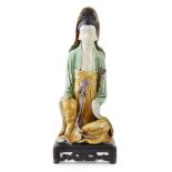 BISCUIT SANCAI-GLAZED FIGURE OF SEATED GUANYIN QING DYNASTY, KANGXI PERIOD