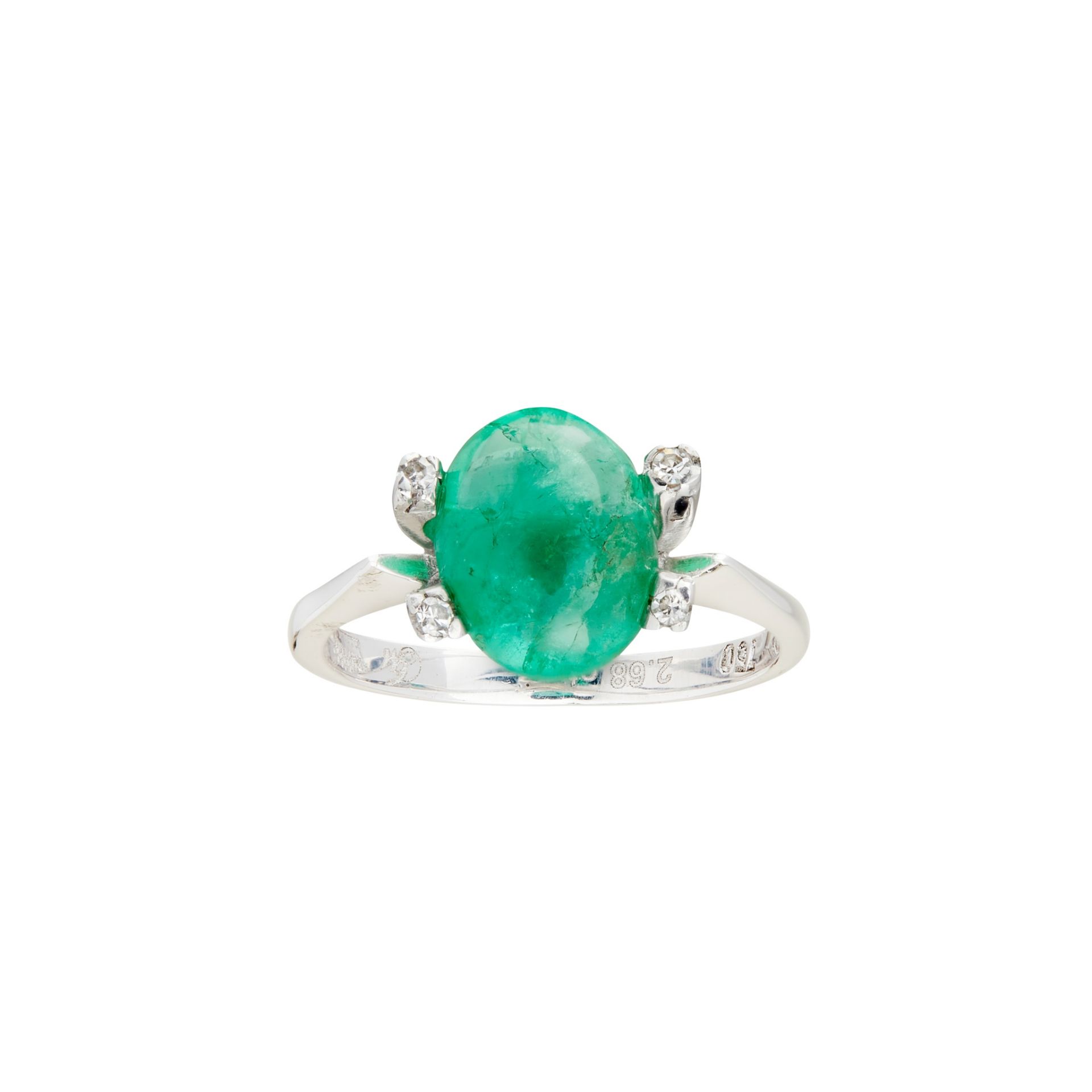 An emerald and diamond set ring