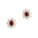 A pair of ruby and diamond cluster earrings