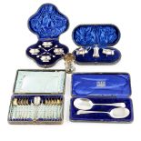 A group of various cased silver sets