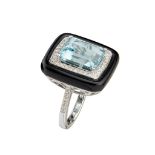 An aquamarine, diamond and onyx set cocktail ring