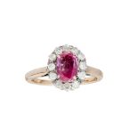 A pink sapphire and diamond ring