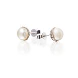 A pair of natural pearl and diamond set earrings