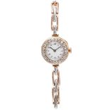 A lady's Edwardian 18ct gold and diamond set wrist watch