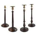 TWO PAIRS OF GEORGE III MAHOGANY AND BRASS CANDLESTICKS LATE 18TH CENTURY